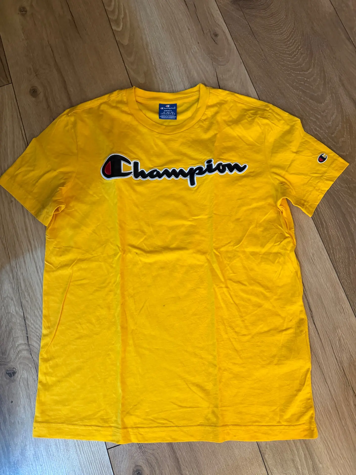 טי שירט צהובה Champion – צ'מפיון יד שנייה בנמיז - Nemyz